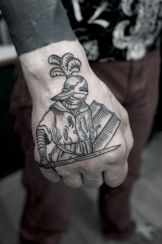 Tiny Armored Knight on the Hand Tattoo Design