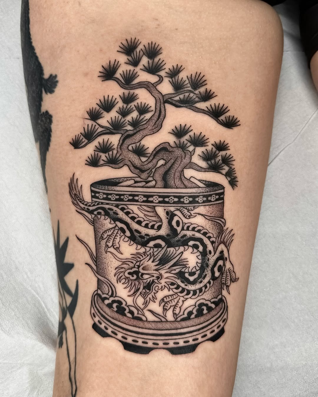 Elegant bonsai tattoo with dragon motif Tattoo Design