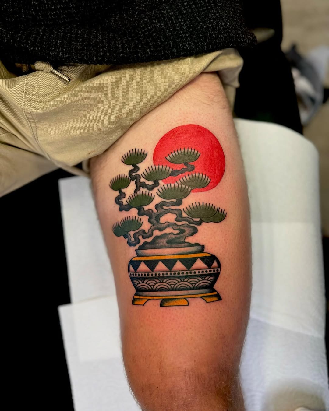 Vibrant bonsai tattoo with red sun detail Tattoo Design