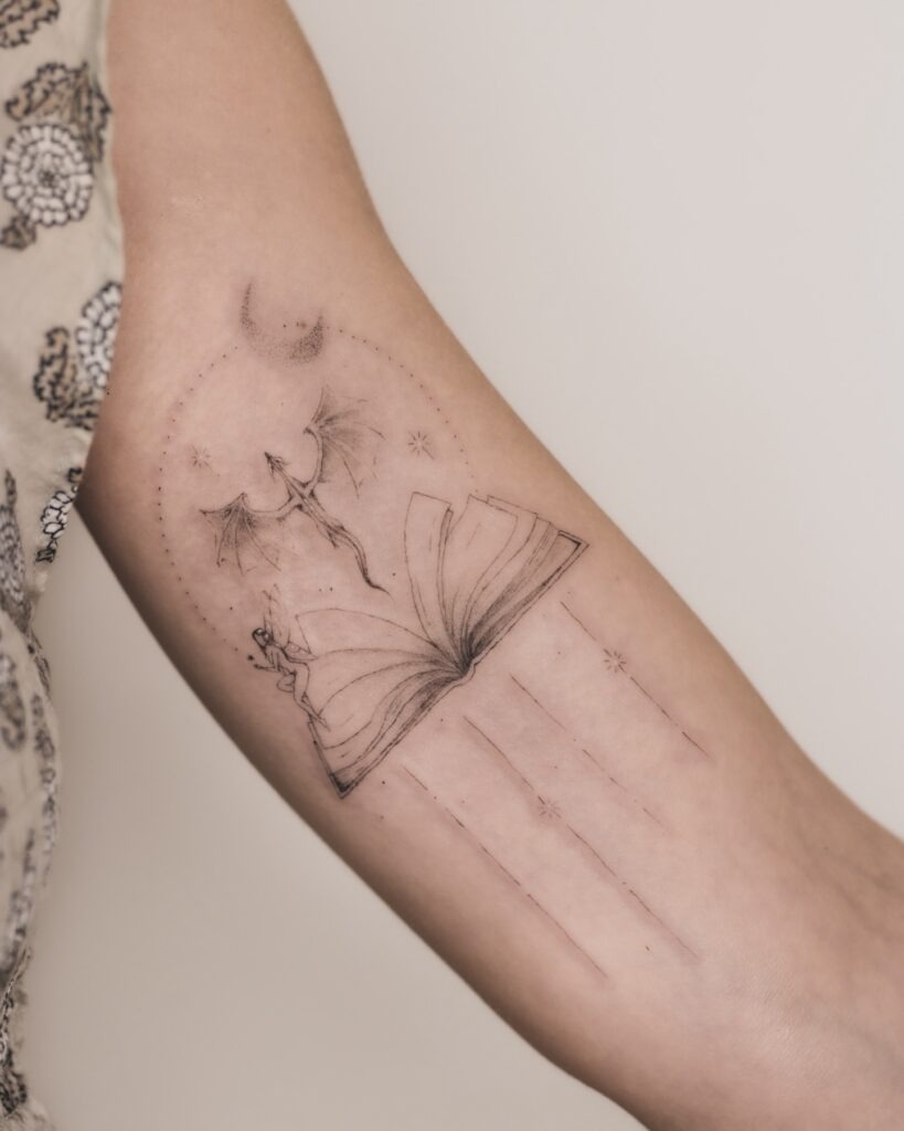 Dragon Rising from the Pages Tattoo Design
