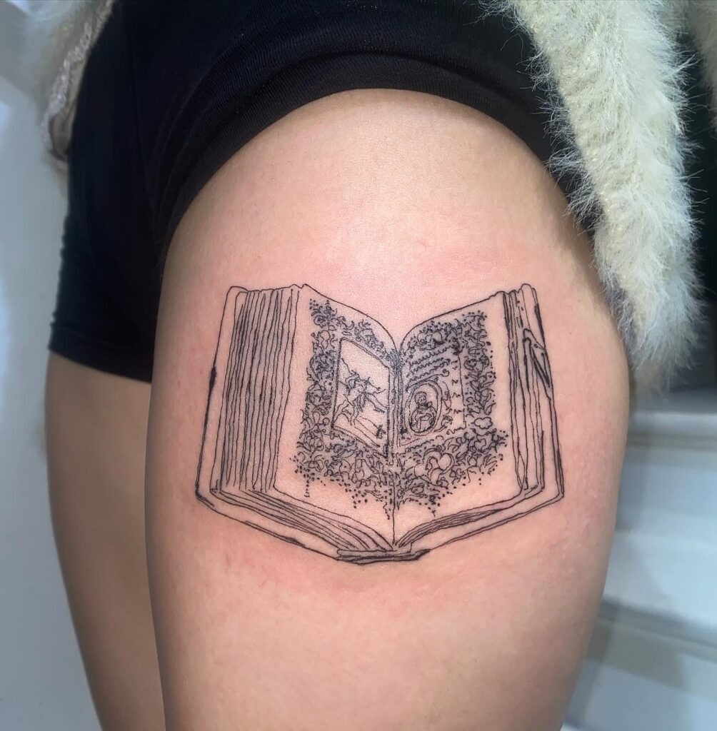Open Illustrated Book with Detailed Pages Tattoo Tattoo Design