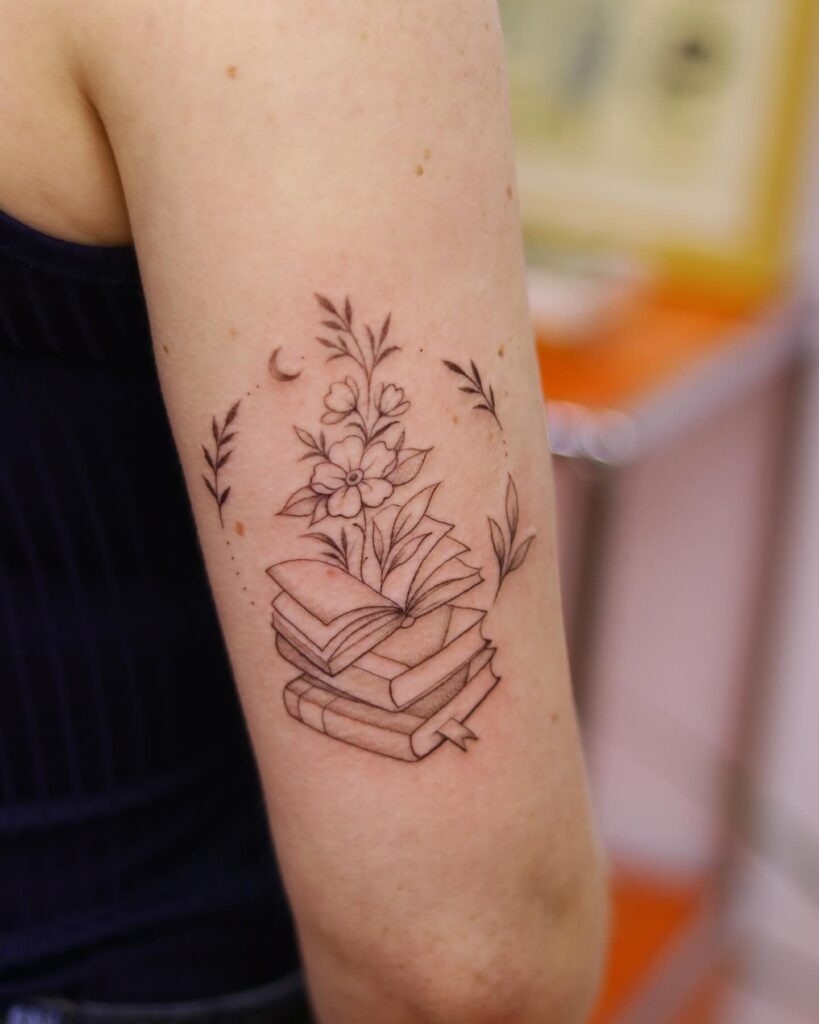 Stack of Books with Blooming Flowers and Crescent Moon Tattoo Design