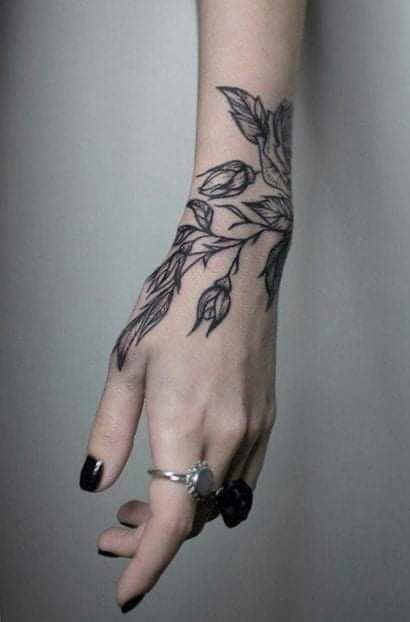 Gothic Botanical Hand Accent Tattoo Design