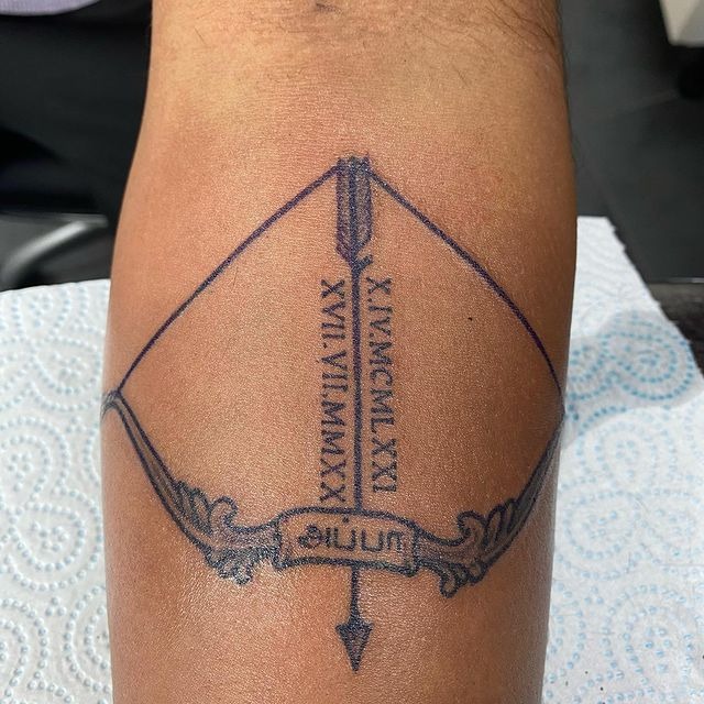 Bow with Roman Numeral Date Dedication Arrow Tattoo Tattoo Design