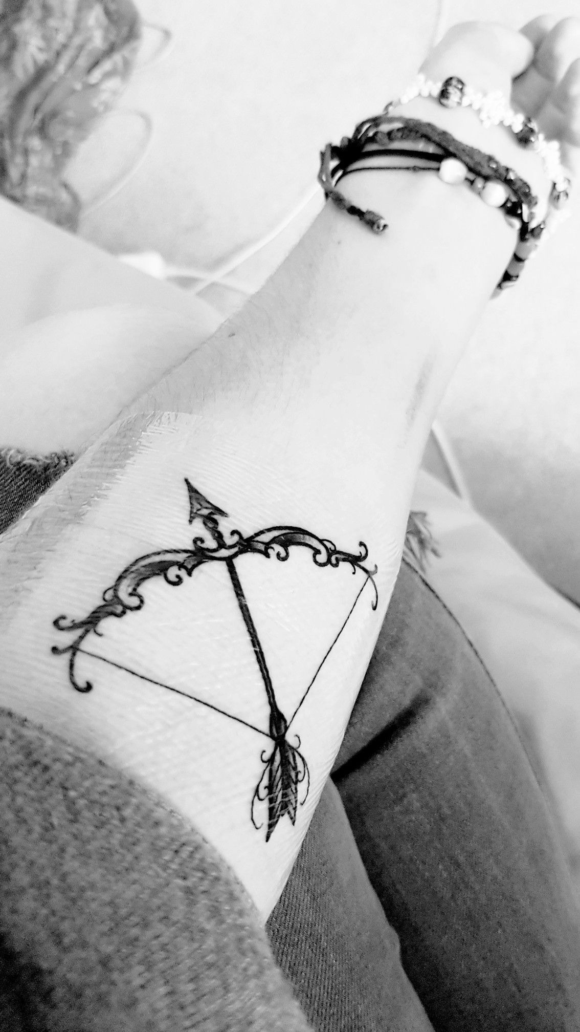 Getting Abstract Arrow Tattoo with an Arrow and Bow Tattoo Design