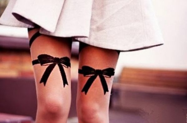 Black, cute design on thighs Tattoo Design