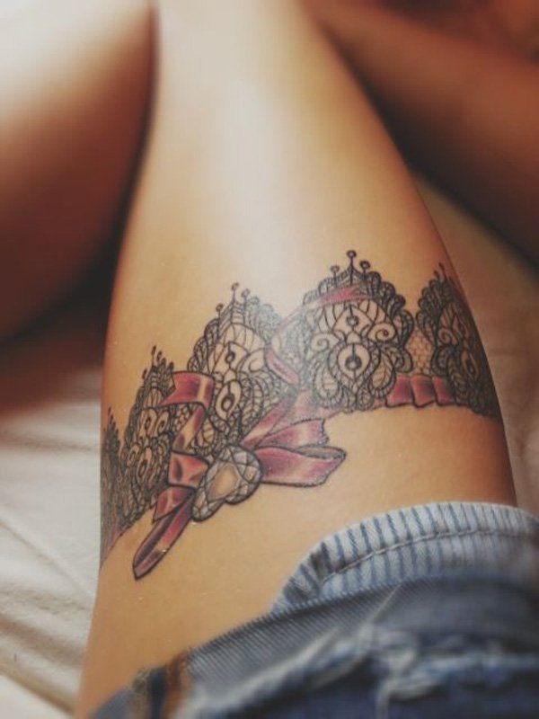 Flirty multi-colored tattoo on a thigh Tattoo Design