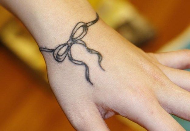 Loose Black Ribbon Tattoo Design