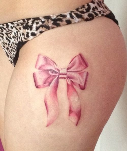 Pink bow tattoo on a thigh Tattoo Design