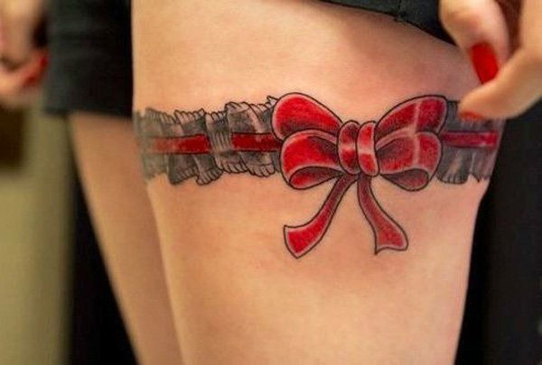 Pretty red tattoo on a girl’s thigh Tattoo Design