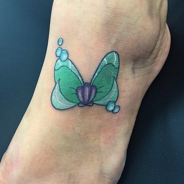 Tiny green bow tattoo Tattoo Design