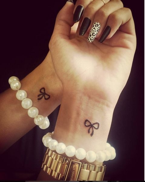 Two Tiny Bows Tattoo Design