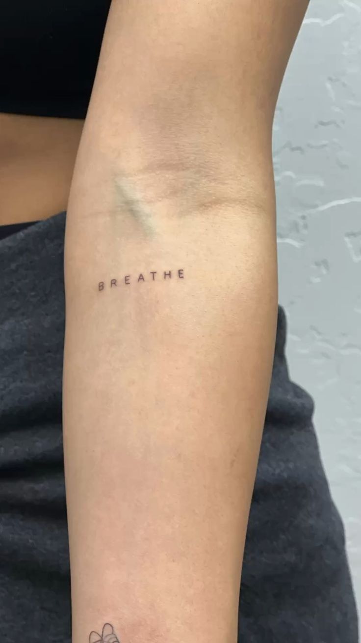Bold Script Breathe Wrist Statement Tattoo Design