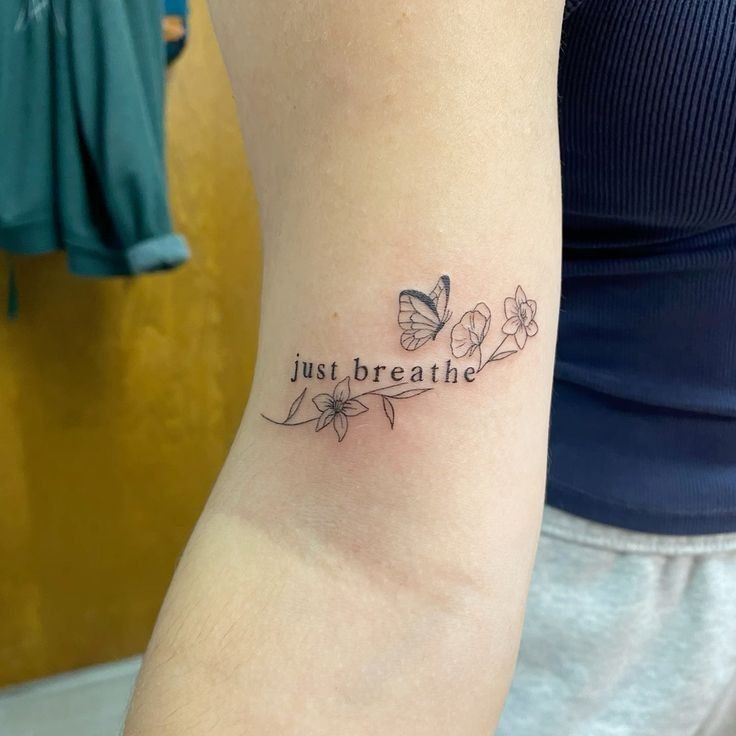 Minimal Breathe Tattoo Along the Forearm Tattoo Design