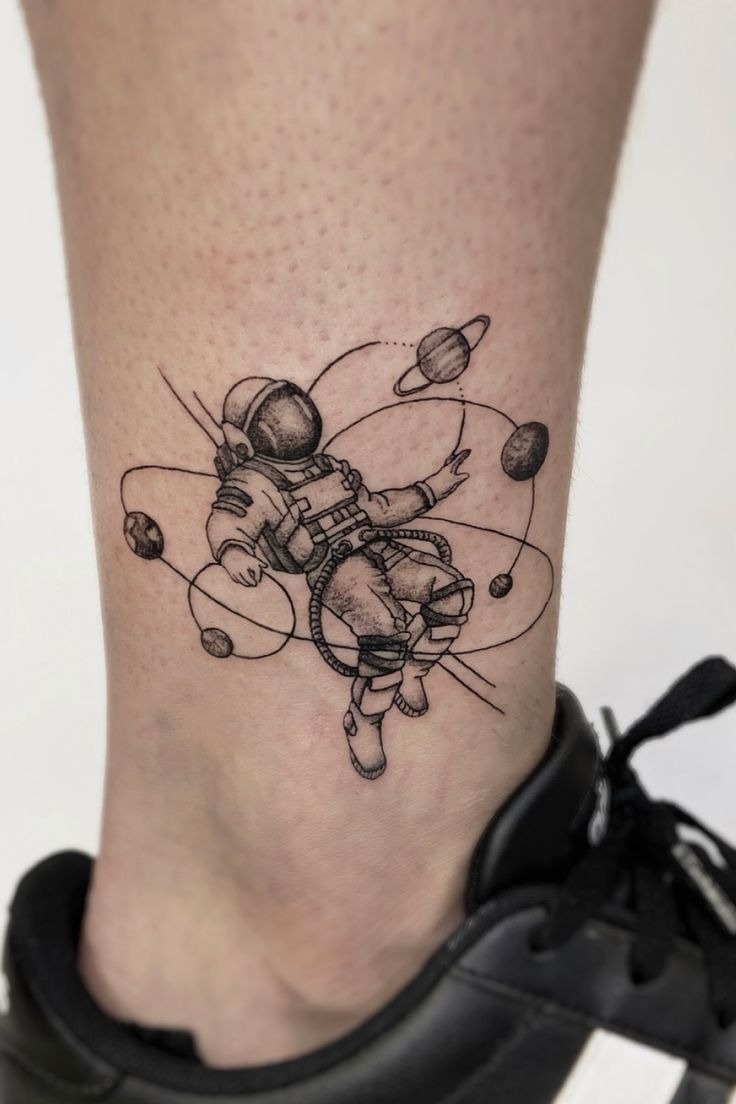 Cloud-Gazing Astronaut Tattoo Design