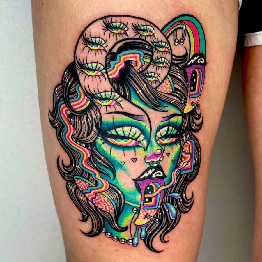 This tattoo showcases an enchanting female figure adorned with colors.