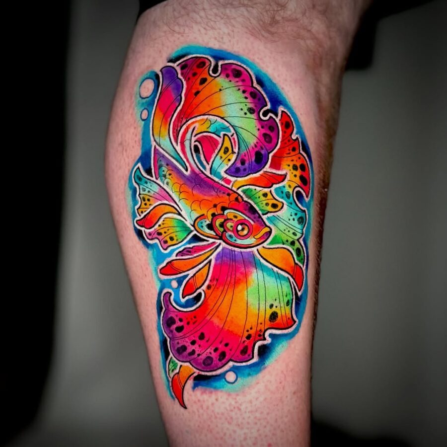 This stunning tattoo features a goldfish surrounded by a brilliantly colored fin.