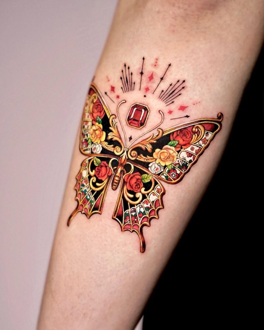 This striking butterfly tattoo features a stunning blend of bright colors and intricate floral designs.
