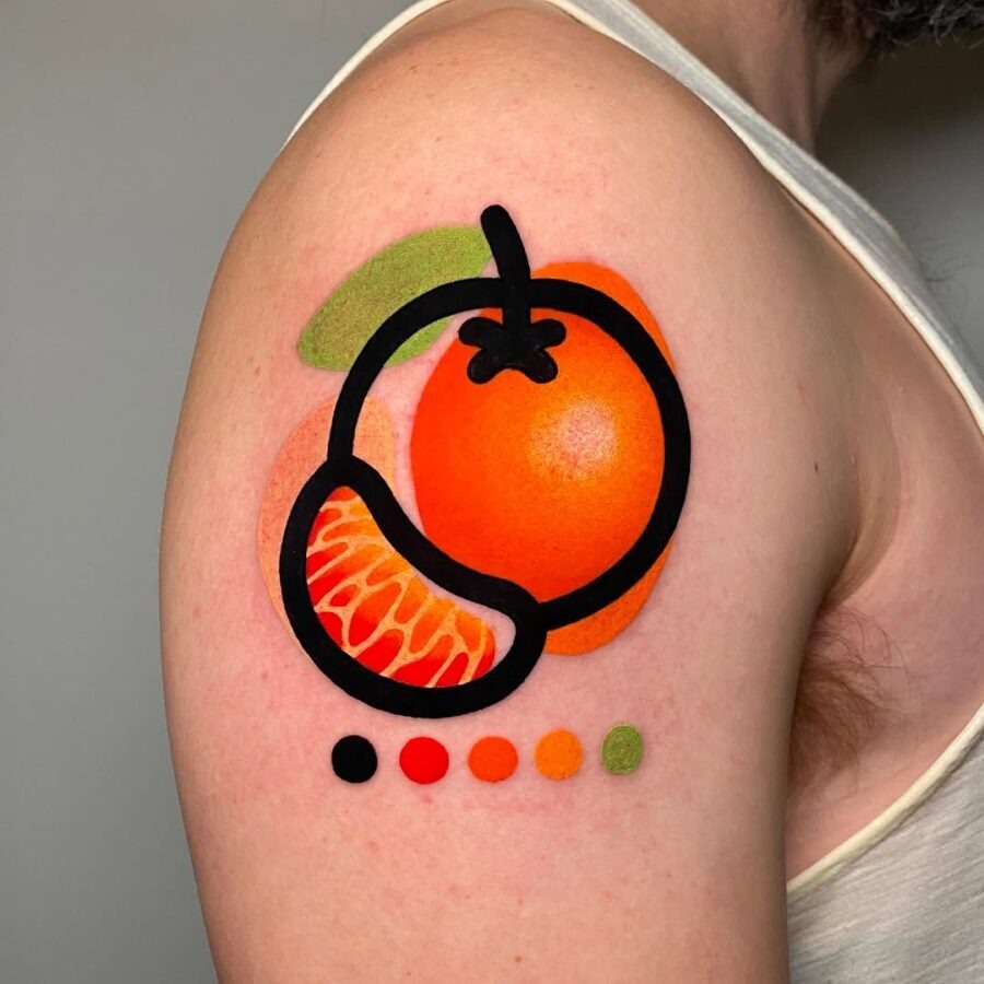 This striking tattoo features a bold and colorful orange, complemented by a tangerine slice and colors.
