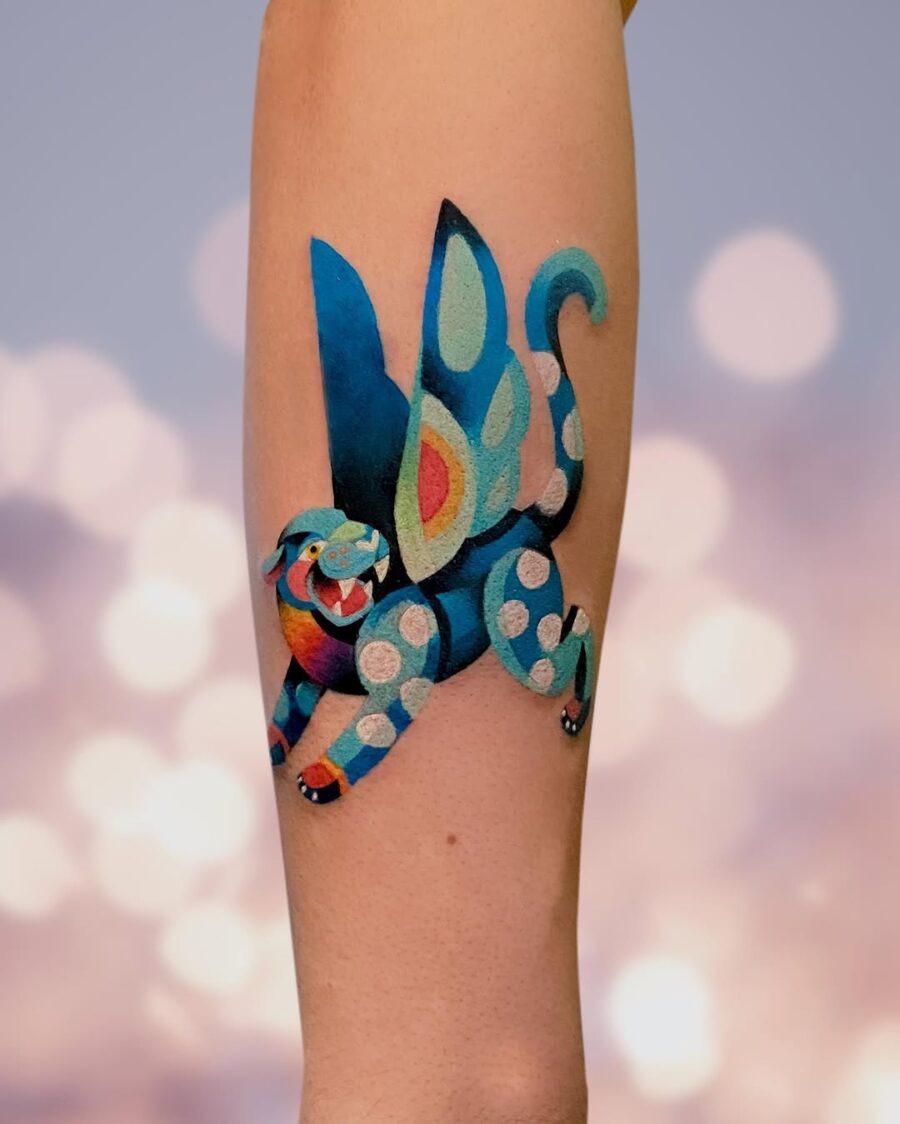 This stunning tattoo features a colorful tiger that seems to leap into action.