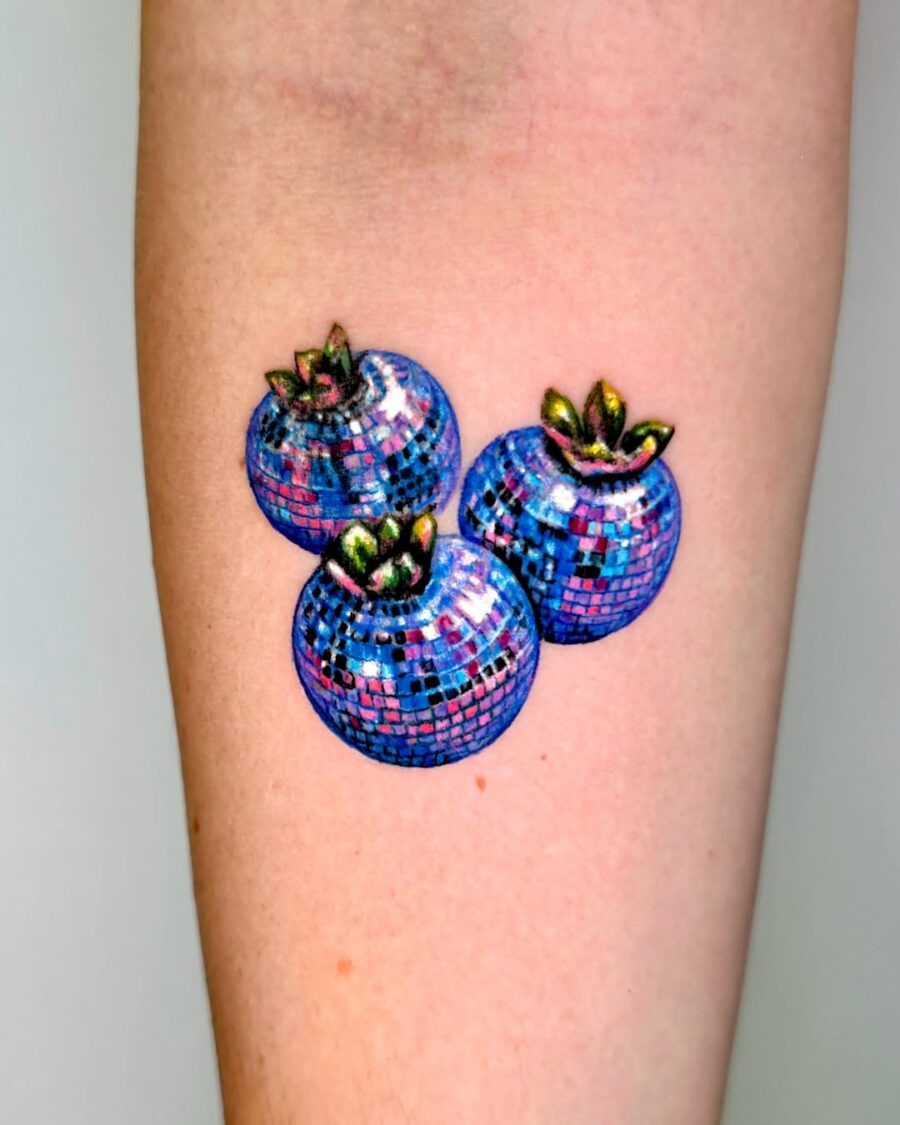 These bright color tattoos feature three shimmering pumpkins, creating a lively and whimsical look.
