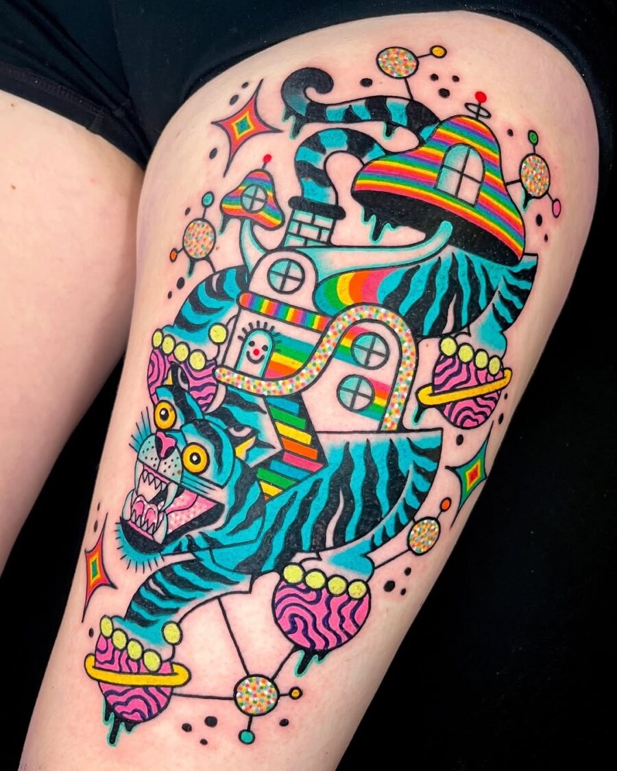 This tattoo showcases a striking tiger with bold colors and playful designs.
