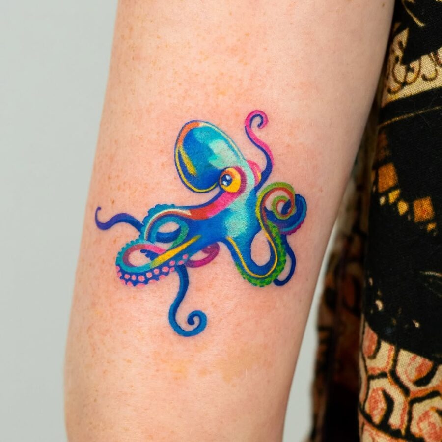 This tattoo showcases a playful and octopus in striking colors.