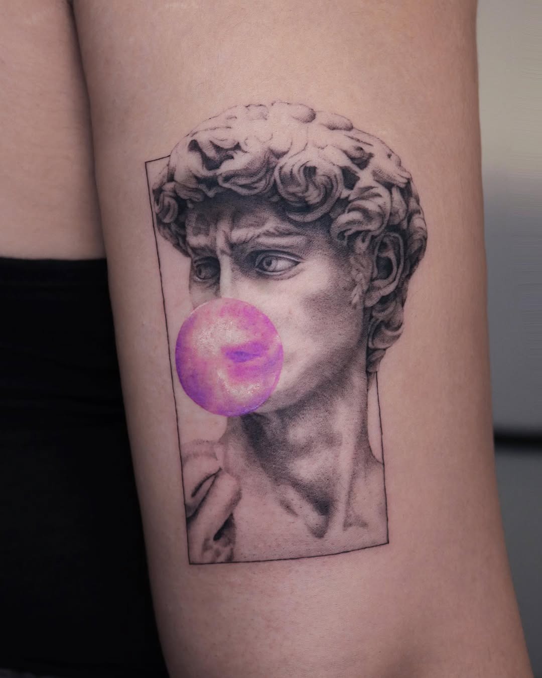 Classic sculpture meets playful bubble gum design Tattoo Design
