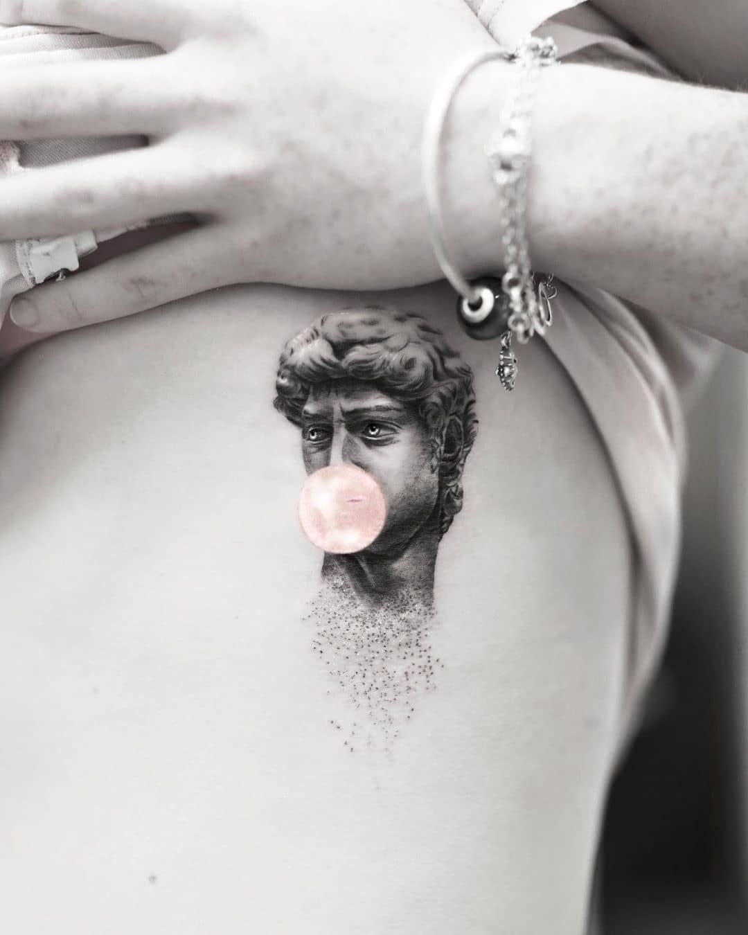 Unique tattoo blending art and bubble gum Tattoo Design
