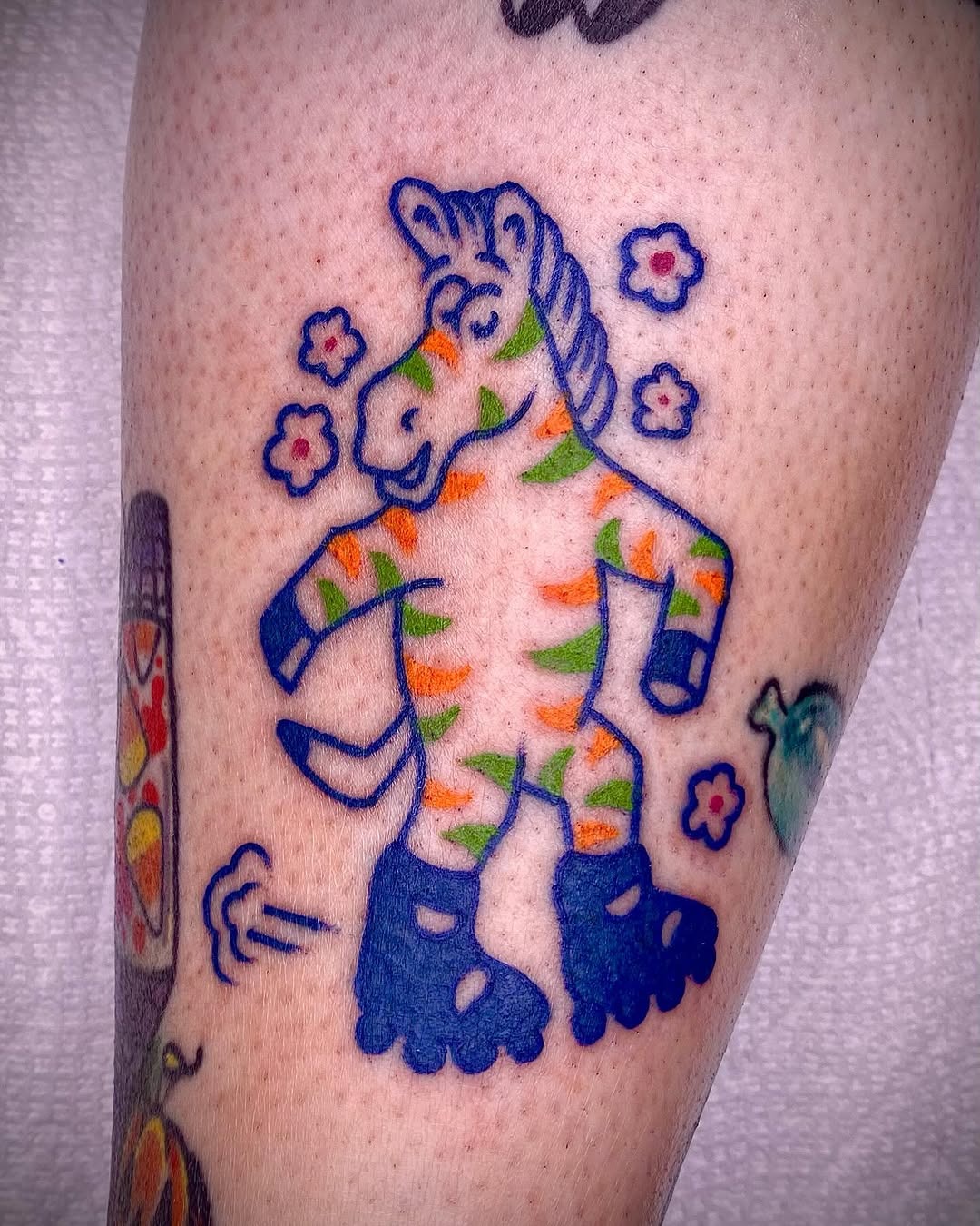 Whimsical zebra tattoo in vibrant colors Tattoo Design