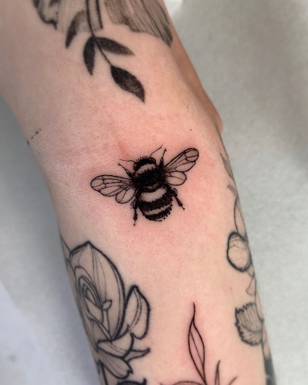 Micro Bee Dotwork Accent Tattoo Design