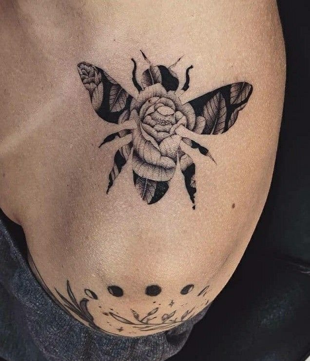 Negative-Space Floral Bee Tattoo Design