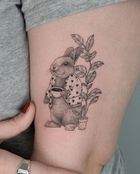 Playful Tiny Bunny Face Tattoo Design