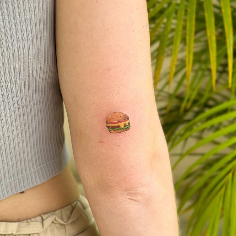 Charming small burger tattoo on the arm Tattoo Design
