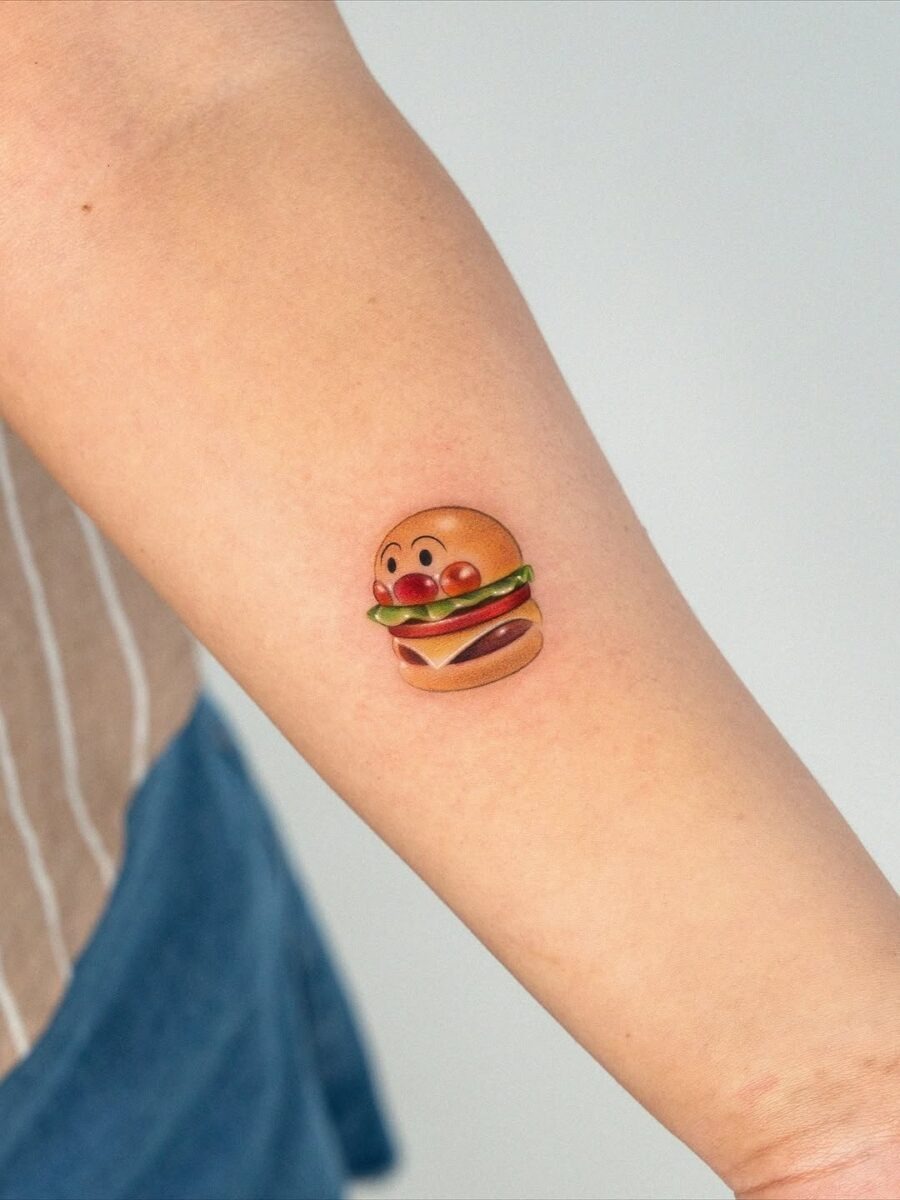 Playful burger tattoo with vibrant colors Tattoo Design