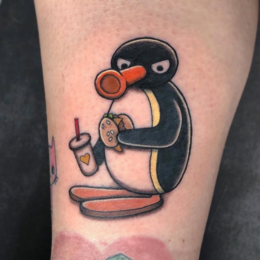 Quirky penguin enjoys a tasty burger tattoo Tattoo Design