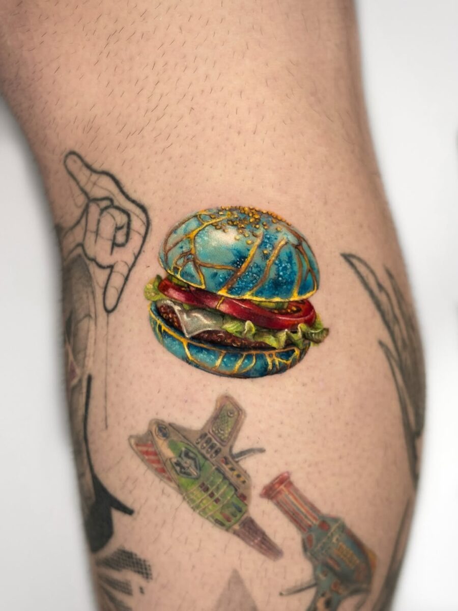 Vibrant burger tattoo with a pop of color Tattoo Design