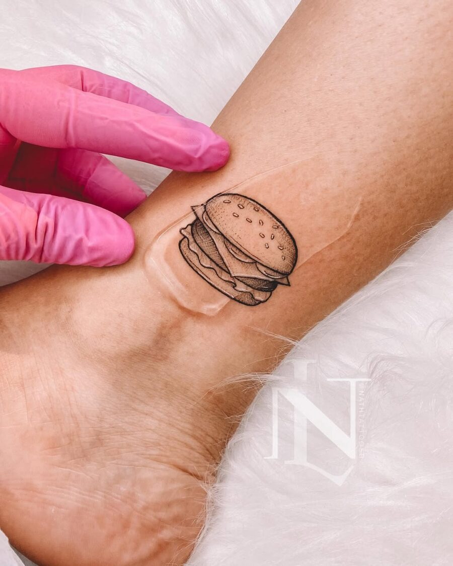 Whimsical burger tattoo on the wrist Tattoo Design