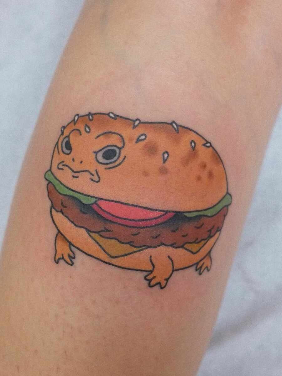 Whimsical burger tattoo with a quirky twist Tattoo Design