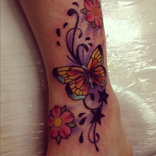 Minimalist Black Butterfly Tattoo on the Forearm Tattoo Design