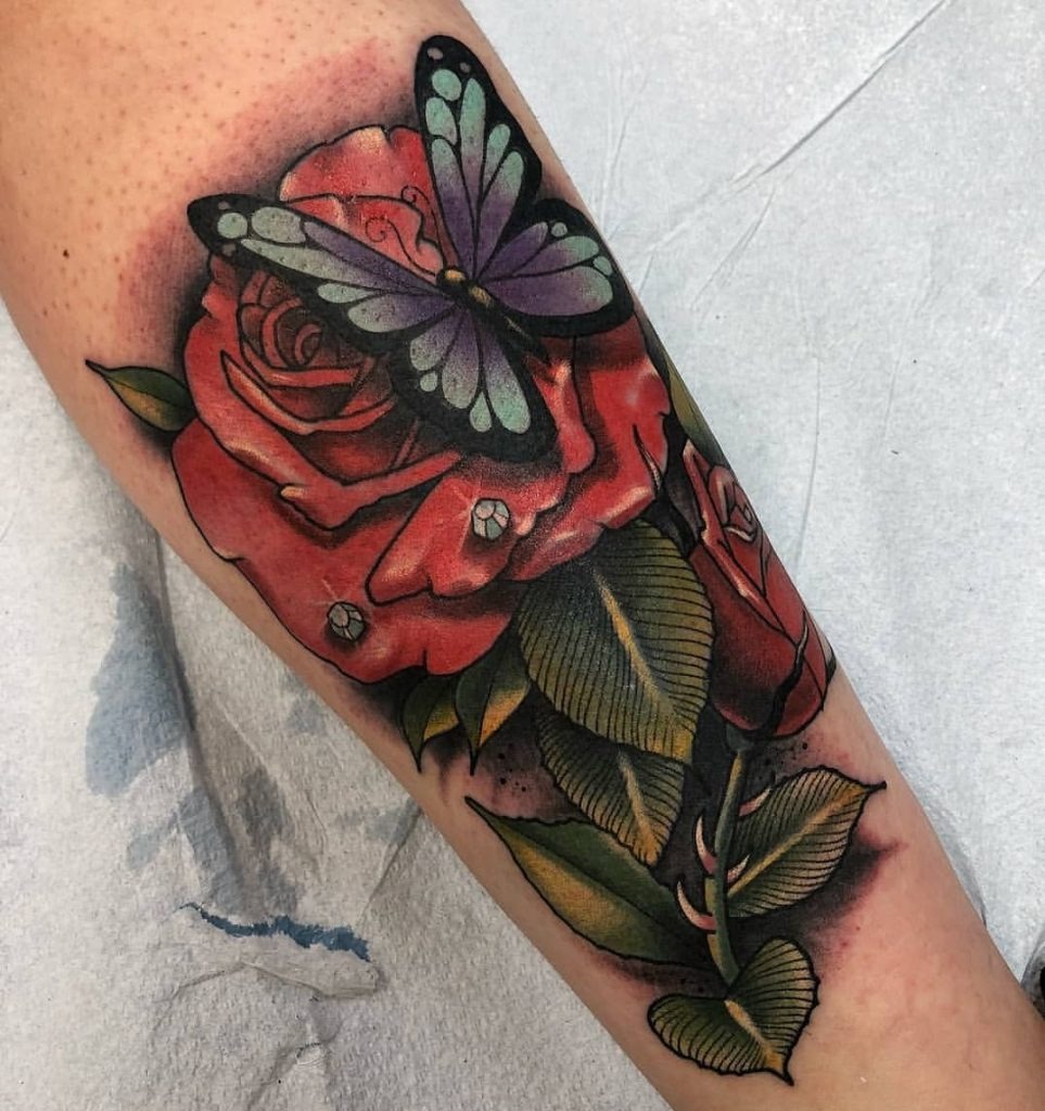 Vibrant Butterfly with Roses on the Forearm Tattoo Design