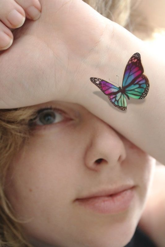 Sexy 3D butterfly on girl's wrist tattoo, detailed design on the wrist.