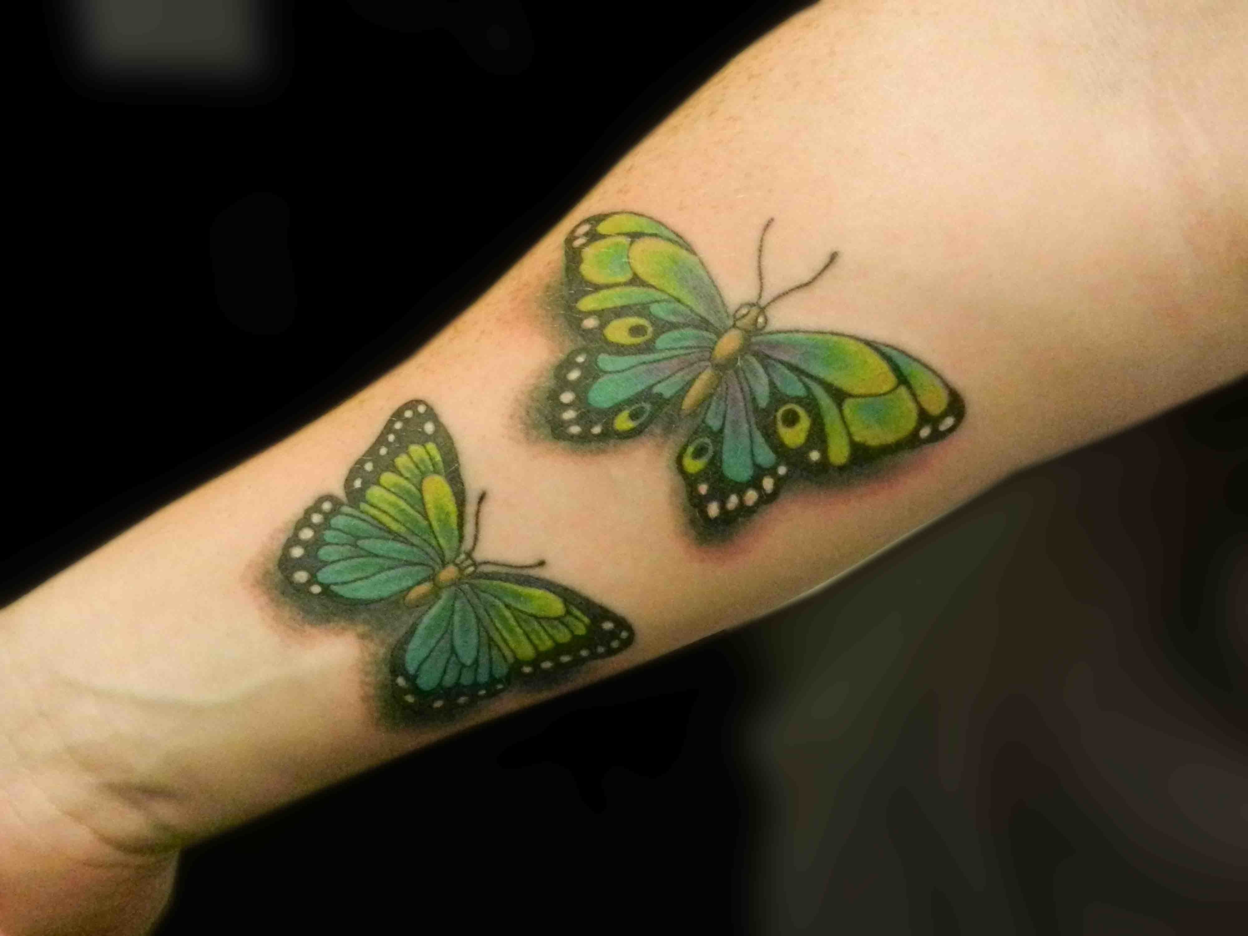 Two Colorful Attractive Butterflies tattoo, realistic design.