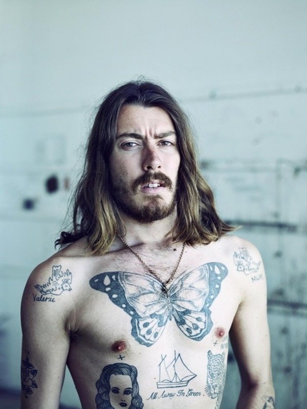 A Dazzling Work of Art on Man's Chest tattoo, detailed design on the chest.