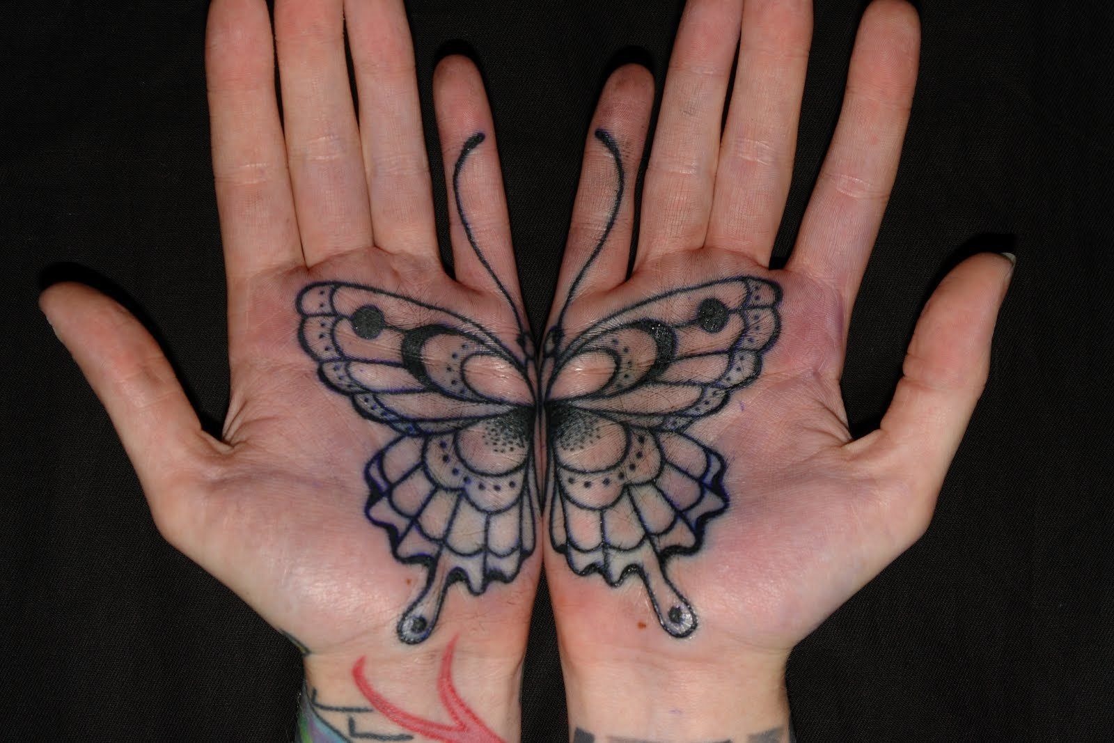 Cool Butterfly Hand-Palm tattoo, detailed design on the hand.