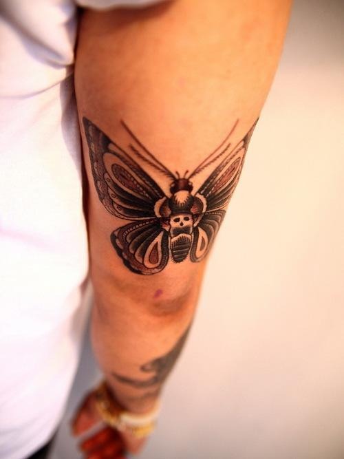 Upper Arm Realistic Butterfly tattoo, realistic design on the upper arm.