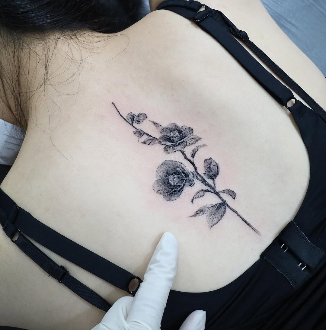Elegant camellia tattoo on shoulder blade Tattoo Design