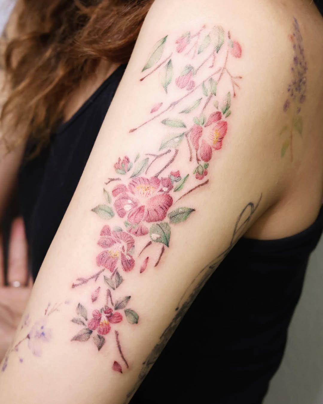 Elegant camellia tattoo showcasing intricate blooms Tattoo Design