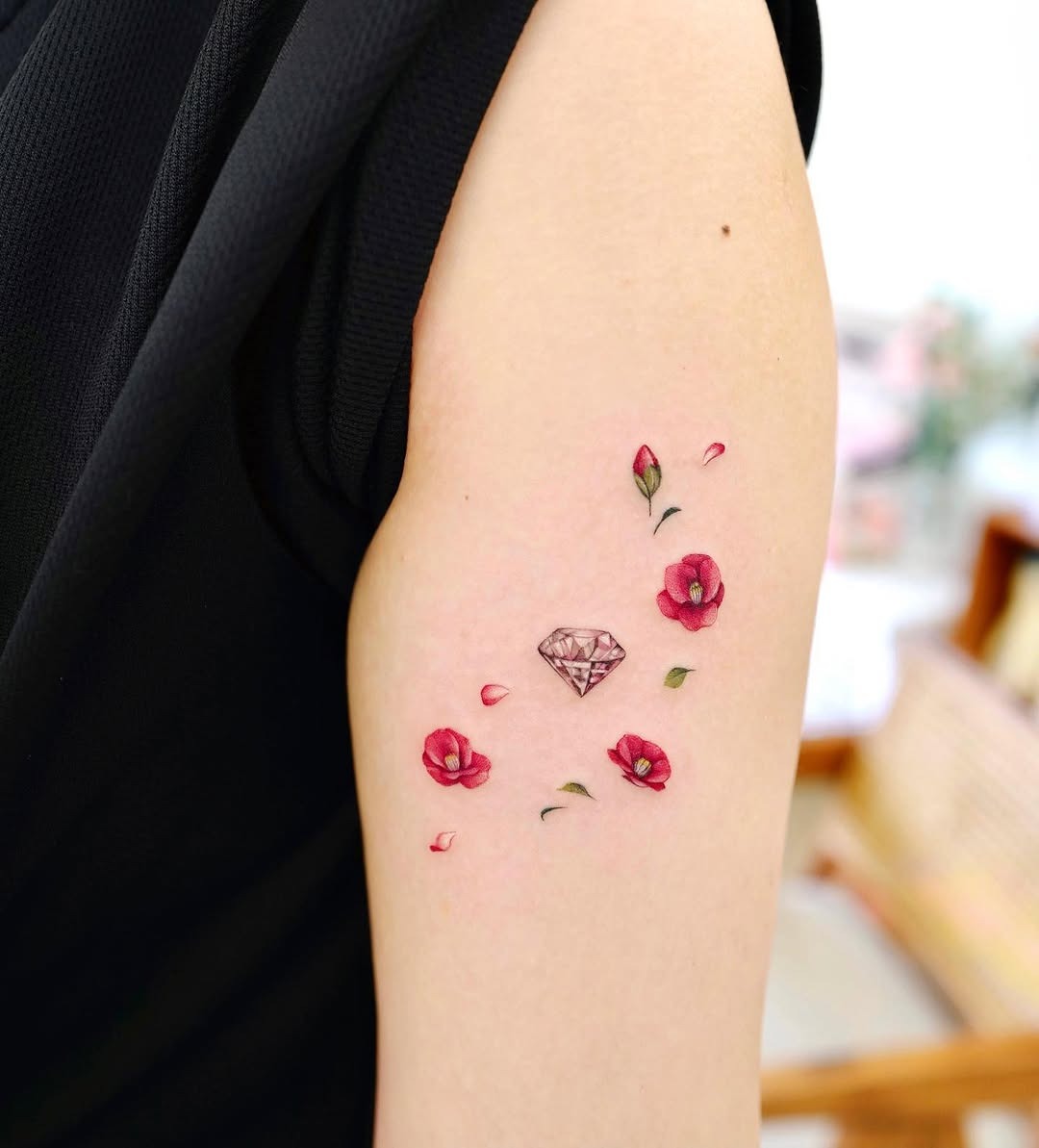 Elegant camellia tattoo with a diamond accent Tattoo Design