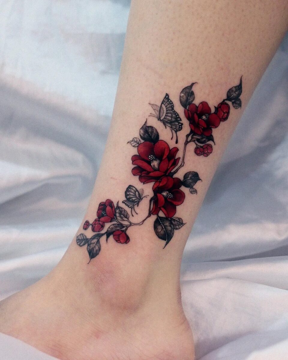 Elegant camellia tattoo with butterflies design Tattoo Design